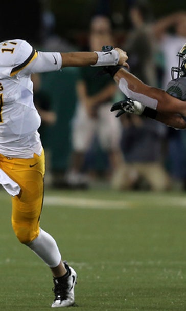 Wyoming QB's passion for football has put him in spotlight